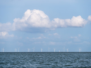 Lake IJsselmeer horizon with wind turbines of windfarm near Urk, Netherlands