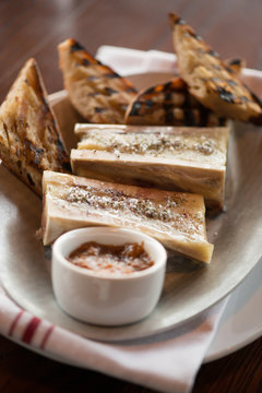 Roasted marrow bones with garlic toasts