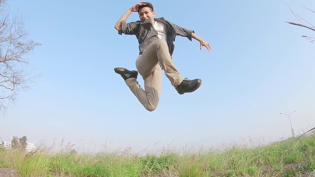 man jump on the grass
