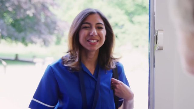 Female care worker on home visit, close up