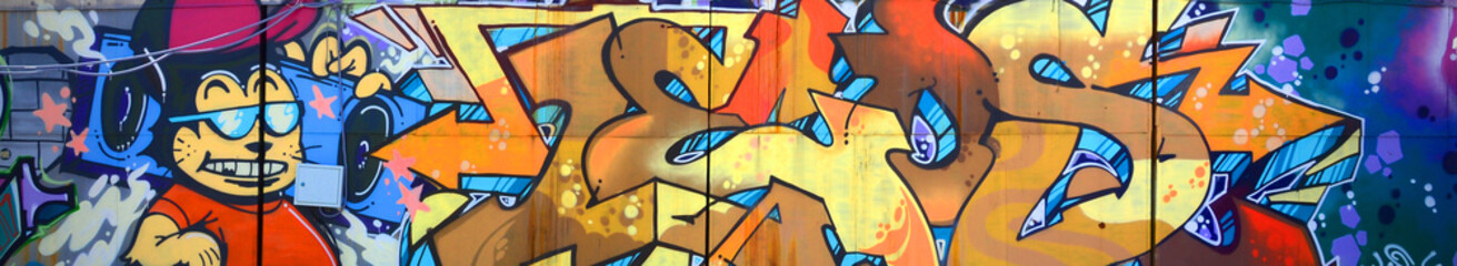 Street art. Abstract background image of a full completed graffiti painting in beige and orange...