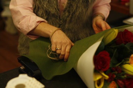 local professional florist arranging a personal bouquet using native Australian flowers and greenery