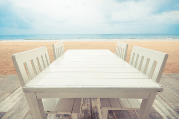 Chairs and table on the beach / Vacation at the sea concept