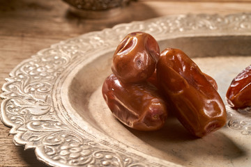 sweet dried dates fruit on metal tray