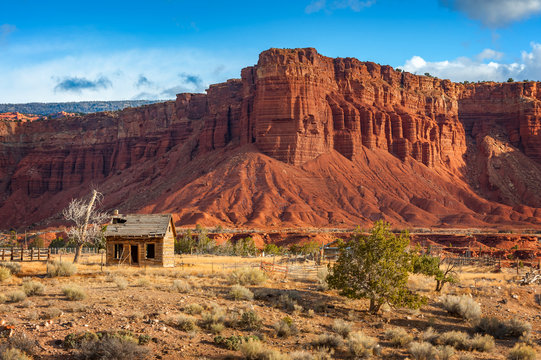 American Southwest Desert Landscape. Classic eroded Navaho sandstone bluffs and blue skies bring up an image of the old west. This is especially true here in Torrey, Utah, near Capitol Reef Park.