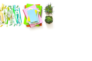 School stationery on blackboard framing. Flat lay, top view trendy back to school concept.