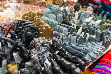 Obraz premium Assortment of traditional hand carved figurines in a market in Aguas Calientes town, in Peru