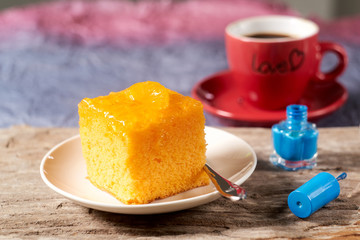 Orange cake on wood table and blurred background