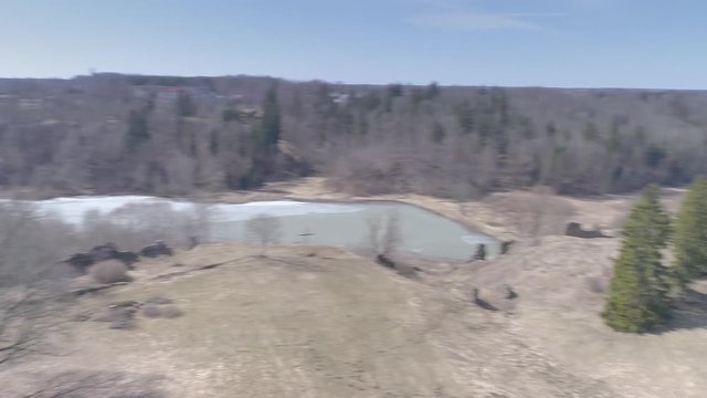 17935_Aerial_view_of_the_small_pond_in_Karksi-Nuia_in_Estonia.mp4
