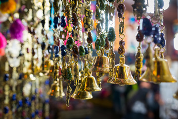 Hanging ornaments with bells, at a a market in Aguas Calientes, Peru