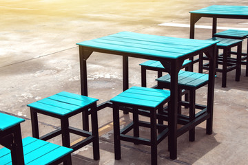 empty seat and table of closed street food restaurant