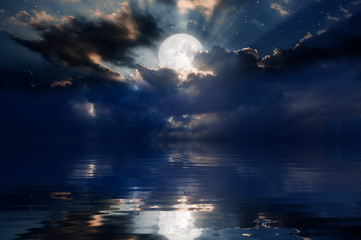 Night sky with moon in the clouds "Elements of this image furnished by NASA