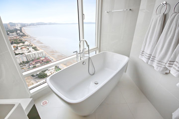 bathtub luxury marbles design with sea view of  tropical Asia hotel interior, white and clean...