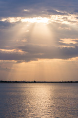 Rays Descending Through Clouds Upon the Lake Near Sunset