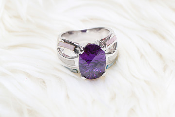 diamond ring and purple gemstone
