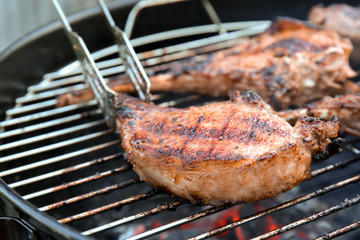 Cooking of appetizing juicy spare ribs outdoors