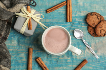 Fototapeta na wymiar Flat lay composition with hot cocoa drink on wooden background
