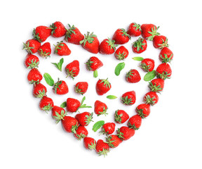 Heart shape made of ripe red strawberries on light background