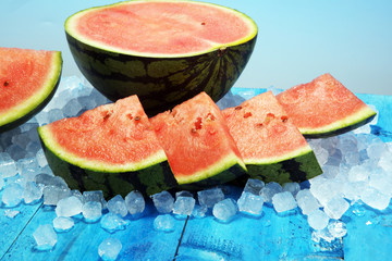 watermelon on blue background. juicy summer fruit in slices