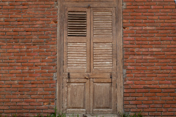 Striped brick walls and wooden door is used as the background.