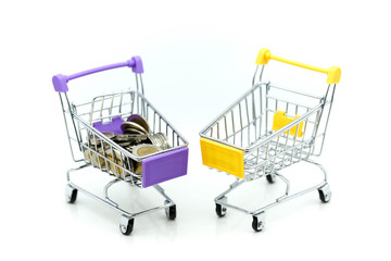 Shopping cart with stack of coins  , business finance shopping concept.