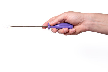 Hand with a screwdriver on a white background isolated. Labor Day concept