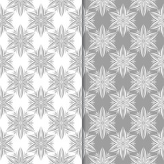 White and gray floral ornamental designs. Set of seamless patterns
