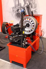 Equipment for car service and repair - tire machine for rolling and alignment of wheel rims