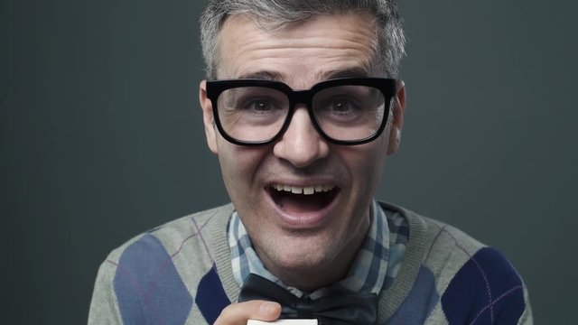 Funny nerd guy giving an engagement ring to his girlfriend