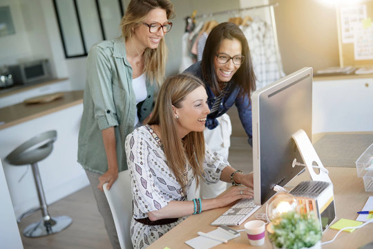 Start-up young women in office, co-working area