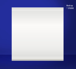 White sheet for photos hanging on the dark blue wall in a room studios Template mock up for display of product or your content. Business background.