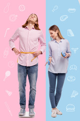 Terrible weight. Young long haired man being on a diet and standing on the scales while his optimistic wife laughing and eating sweets