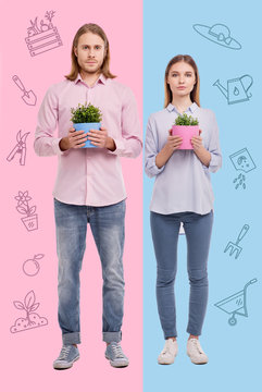 Common activity. A couple of professional gardeners looking calm and confident while standing in similar clothes and holding flower pots