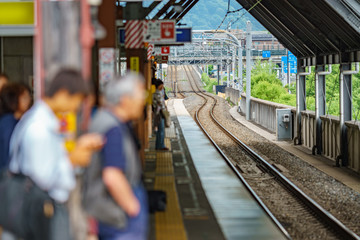 Fototapeta premium Blurred people waiting for train