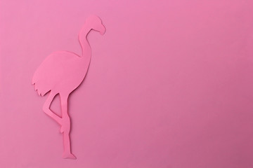 pink paper cut flamingo on a pink background