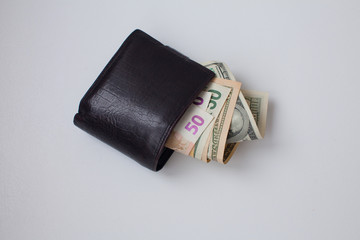Stylish men's purse with money on white background