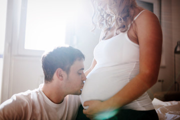 Fototapeta premium Happy pregnant woman relaxing with her husband