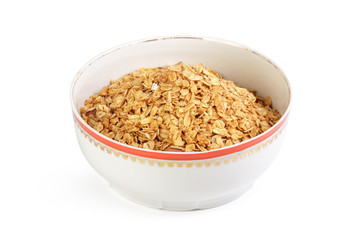 Bowl of whole grain muesli isolated on white background