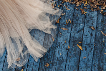 wedding dress on a blue wooden background