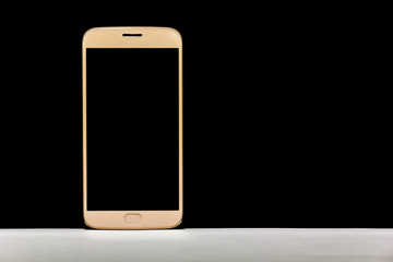 Blush gold color smartphone on the white floor with black background, Bangkok, Thailand