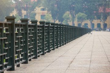 Steel fence in China style along the pathway at Ba Dinh Square, Hanoi, Vietnam