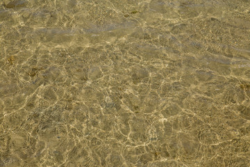 the sandy bottom of the red sea and the sun's rays