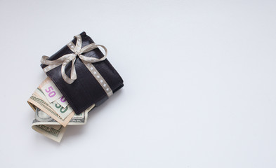 Black wallet over white background. buying gifts on  holiday