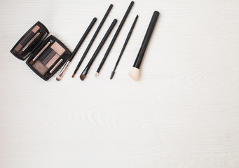 Set of makeup brushes on white background. Top view point, flat lay. Makeup natural brushes