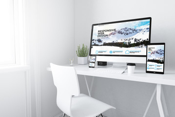 Fototapeta na wymiar devices on white minimal workspace responsive website