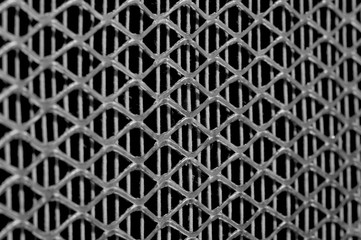 Metal lattice texture close-up. The image is inclined. Rhombus.