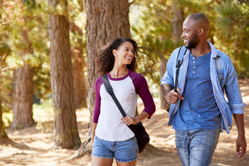 Couple On Hiking Adventure In Wooded Countryside