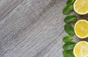 Cut lemons and mint leaves