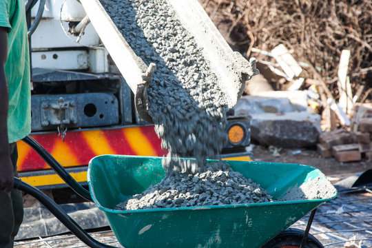 Concrete Pouring Into Wheelbarrow, Showing Movement