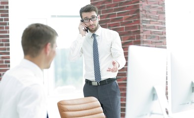 businessman with smartphone on blurred background office